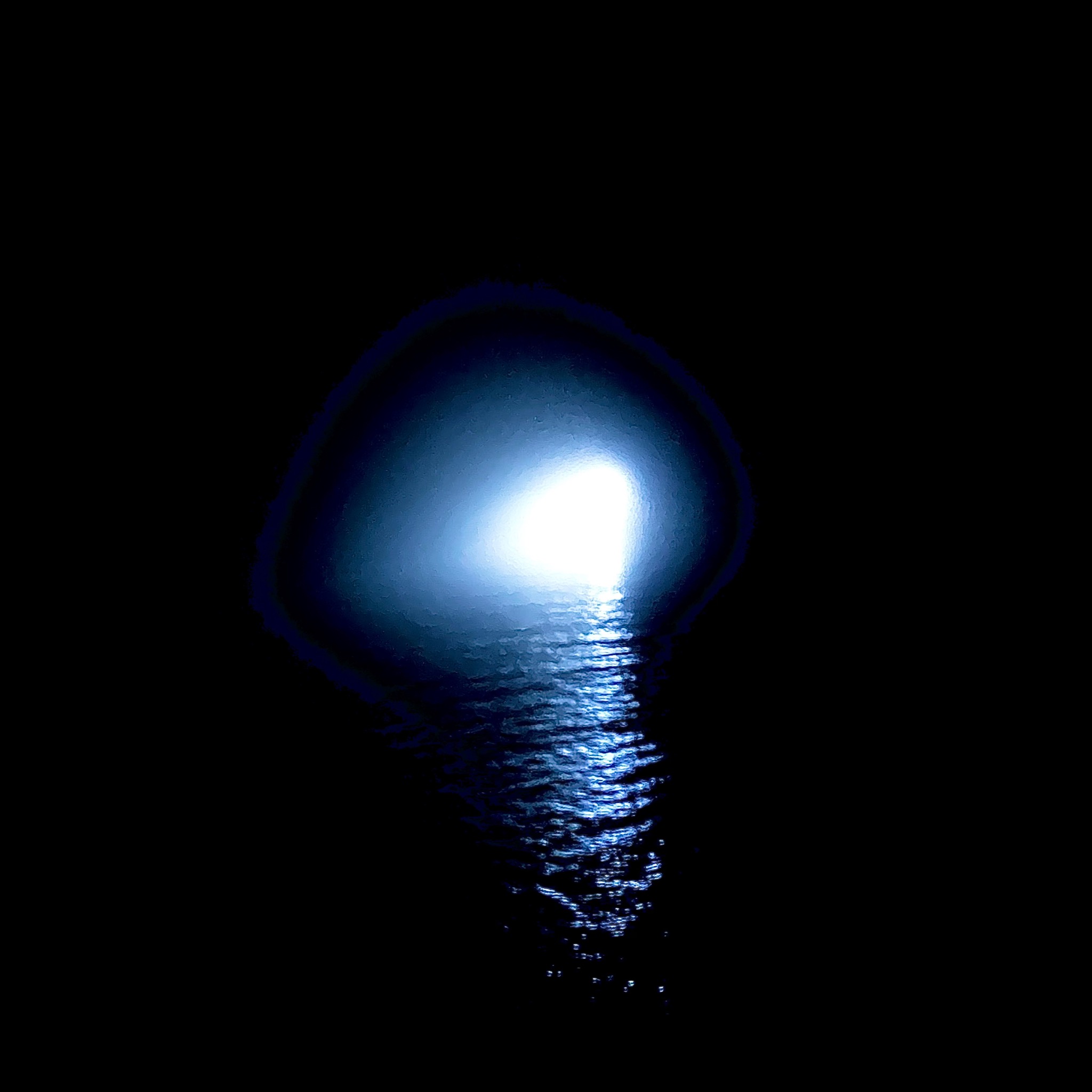 Blue light and water in a dark space