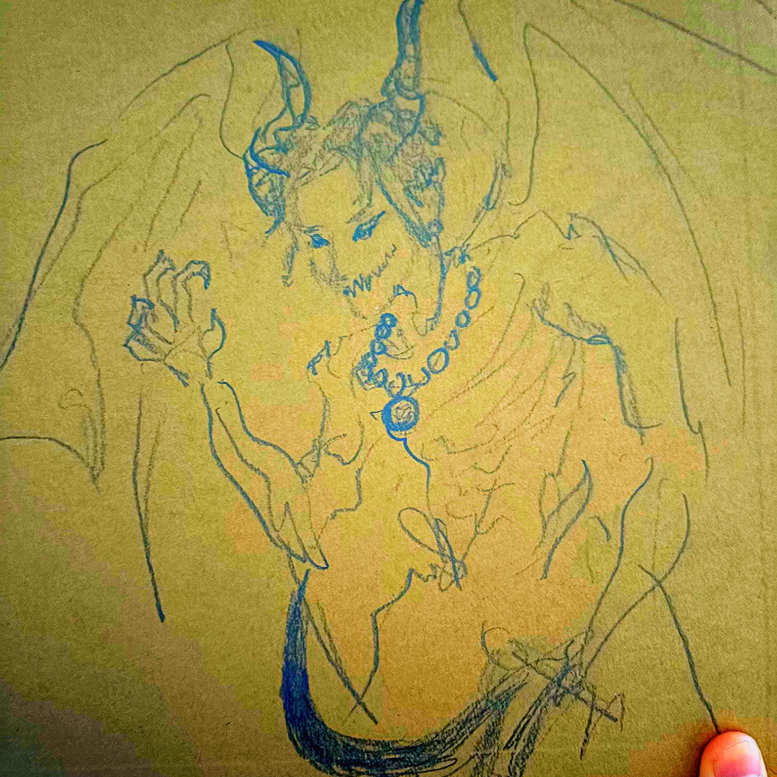 Blue line-character drawing on paper