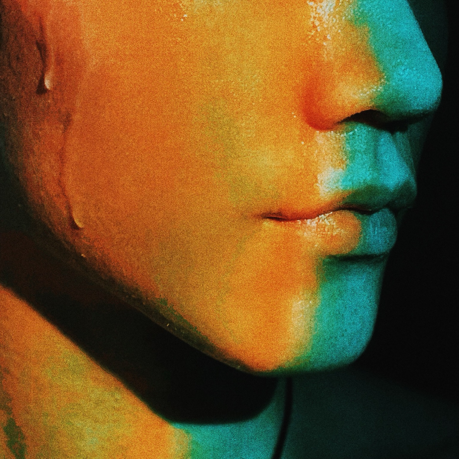 Face close-up in orange and cyan light