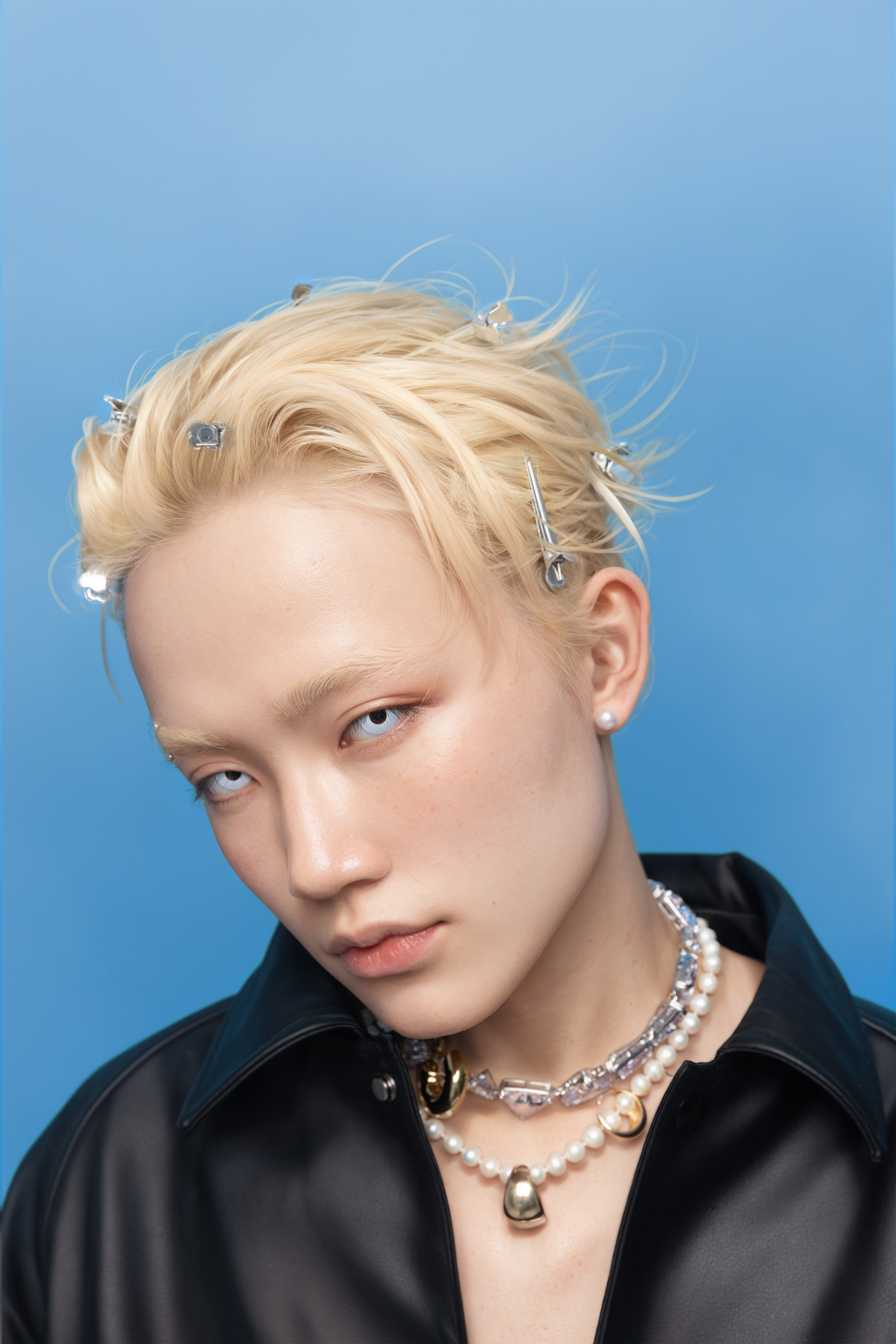 Blonde portrait against a blue background