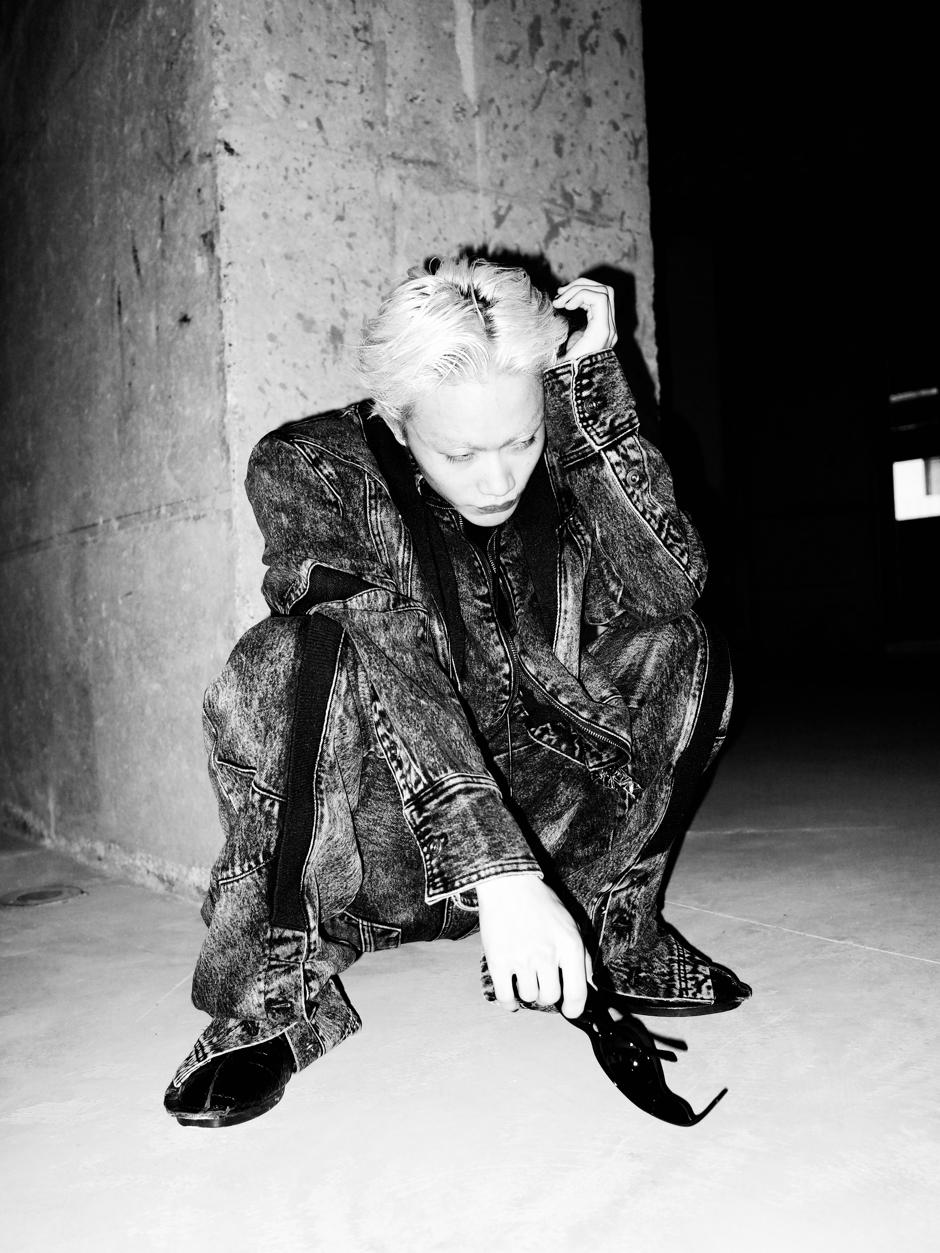 Monochrome figure in a concrete space