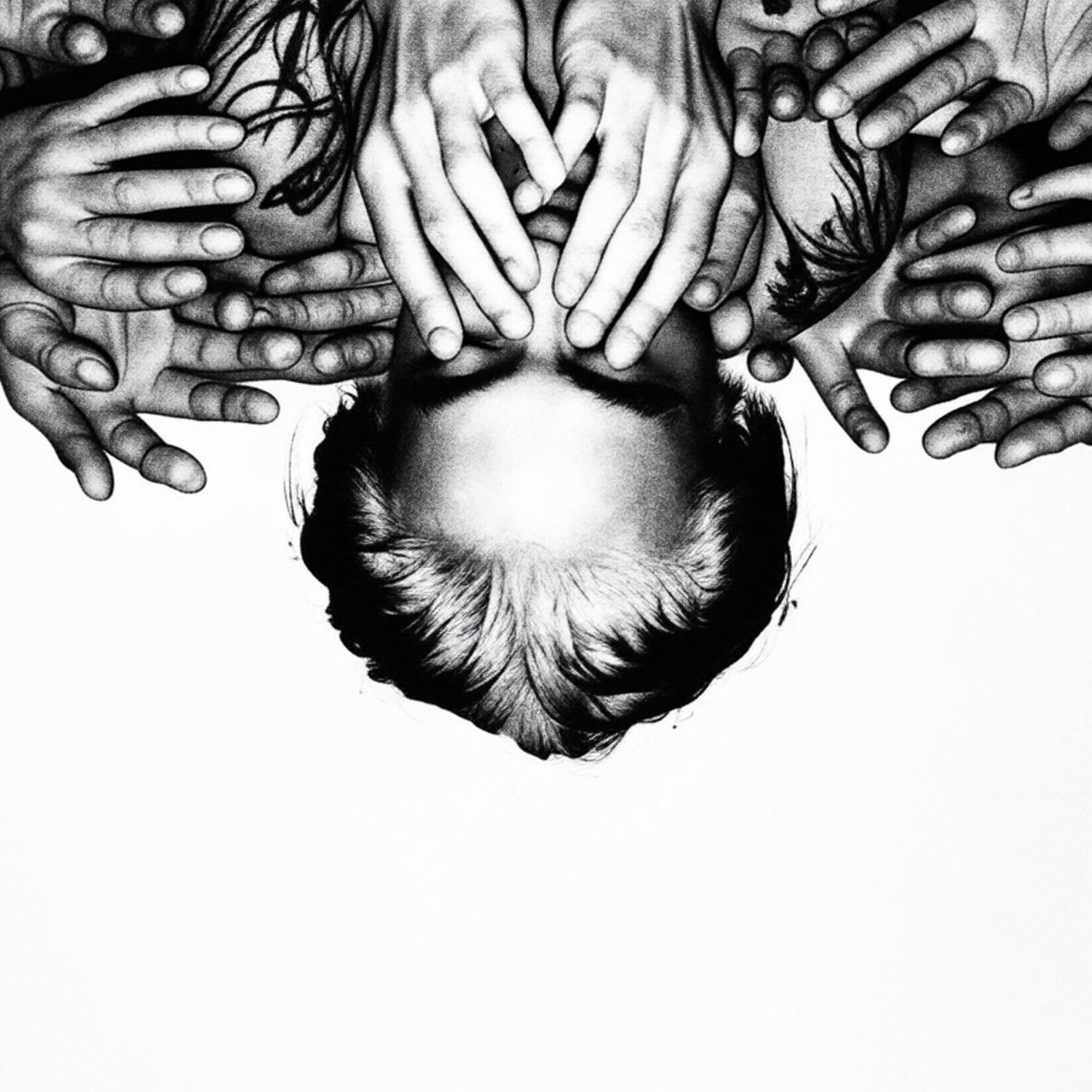 Monochrome portrait framed by hands