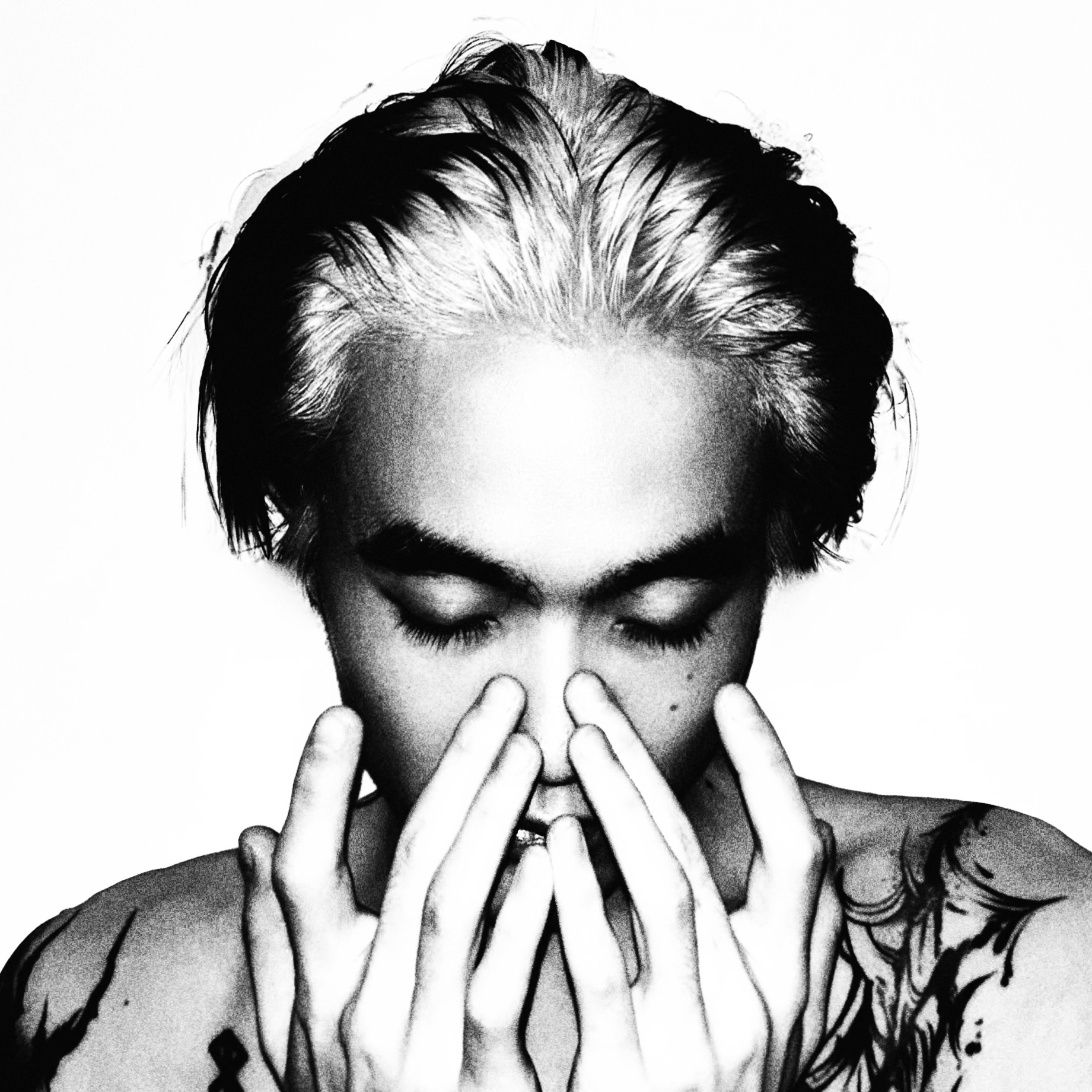 Monochrome portrait with hands near the face